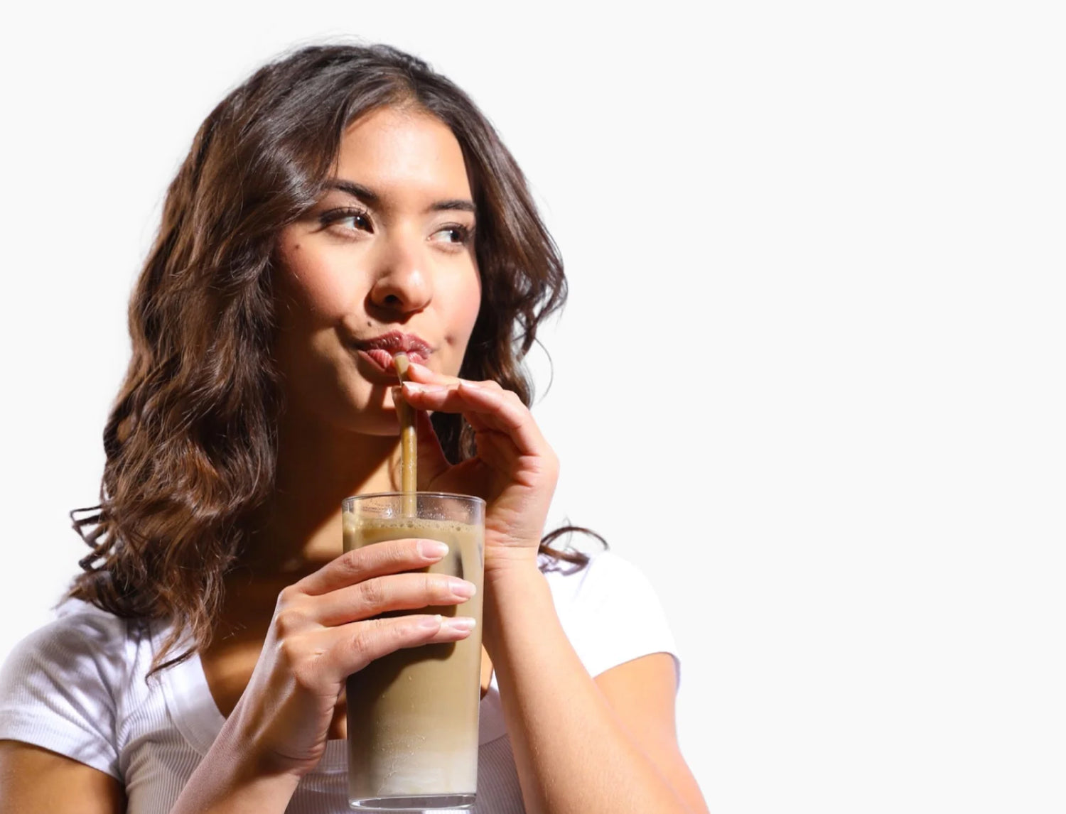 drinking organic Hojicha from a straw