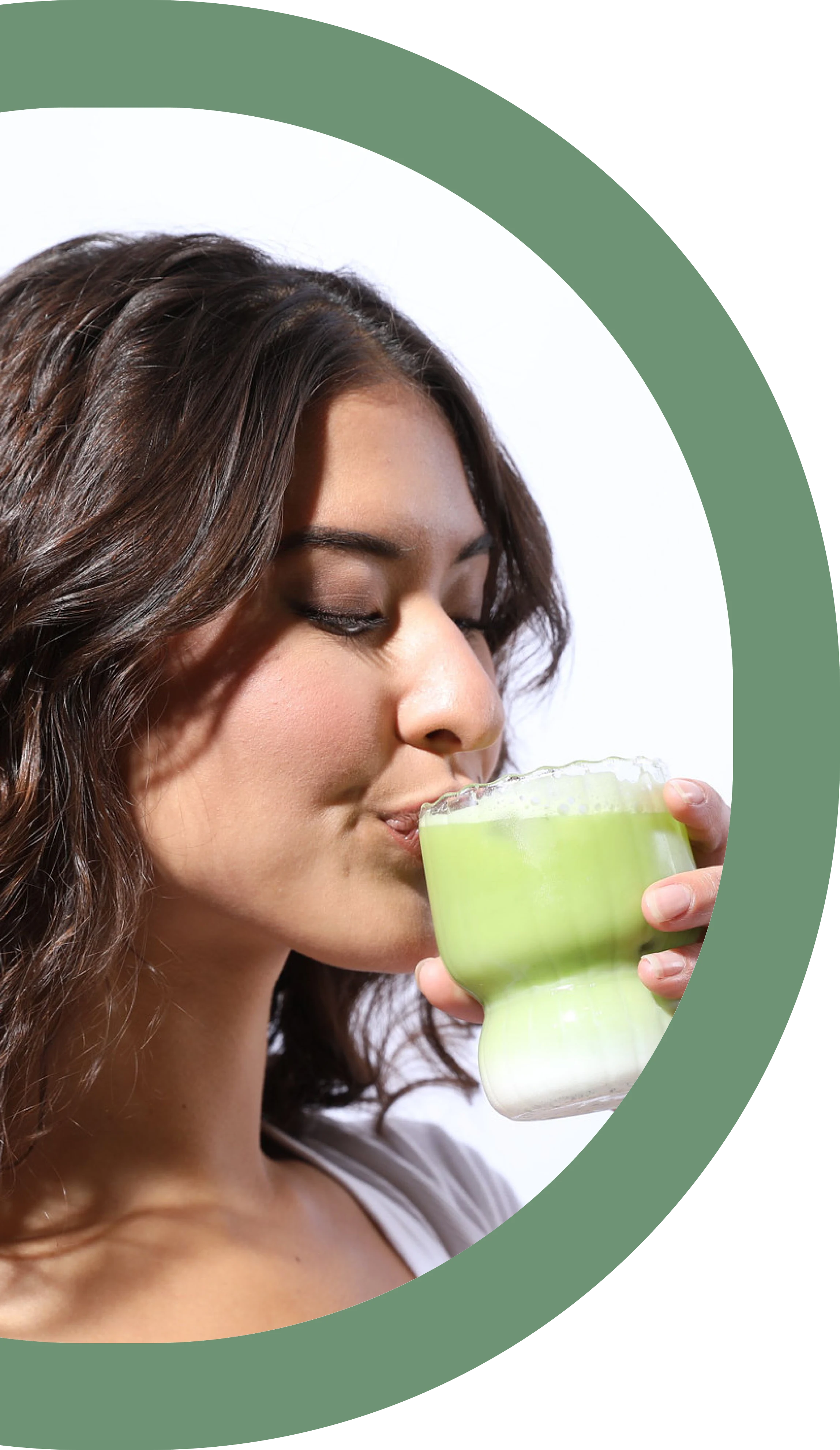 Woman Drinking Matcha in a clear Glass with Milk