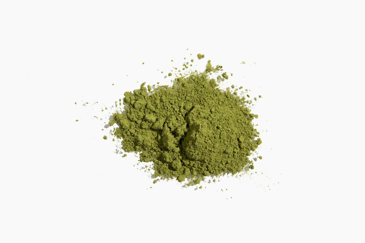 Decaf matcha powder on a white background